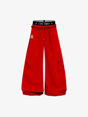 Pantalones paracaidista de pierna ancha con cruz estampada en la cintura – rojo, vista frontal | XoKool