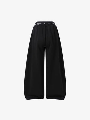 Y2K Jogginghose mit Schriftzug-Print und Layered-Bund – Schwarz, Rückseite flach | XoKool