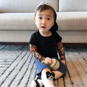 It’s not every day you see a toddler or kid sporting some awesome tats. Dress your cool kid in this shirt and it will be sure to turn heads! It comes with printed tattoos on each sleeve 👦 ☑️ This incredibly unique, unisex outfit is perfect for any occasi