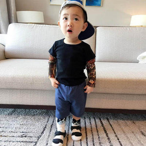 It’s not every day you see a toddler or kid sporting some awesome tats. Dress your cool kid in this shirt and it will be sure to turn heads! It comes with printed tattoos on each sleeve 👦 ☑️ This incredibly unique, unisex outfit is perfect for any occasi