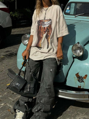 Show your attitude with the American Tide Loose Print Round Neck T Shirt — a bold essential for modern streetwear fans. Crafted from soft and breathable cotton, this relaxed-fit tee features a standout hand gesture graphic layered with bold text for an ed