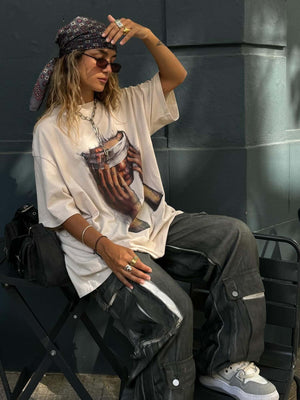 Show your attitude with the American Tide Loose Print Round Neck T Shirt — a bold essential for modern streetwear fans. Crafted from soft and breathable cotton, this relaxed-fit tee features a standout hand gesture graphic layered with bold text for an ed