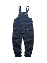 Redefine casual comfort with the Cargo Overall Pants — a stylish and functional piece that brings workwear edge to everyday outfits. Made from sturdy denim, these overalls feature adjustable shoulder straps, a button closure, and multiple front pockets fo