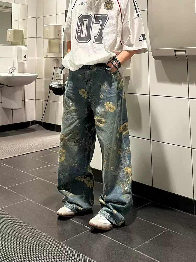 Bring retro vibes to your wardrobe with the Carpenter Pant. Crafted from durable denim, these high-waist, wide-leg pants feature a unique vintage floral print for a standout casual look. The elastic waistband ensures a secure and comfortable fit, while th
