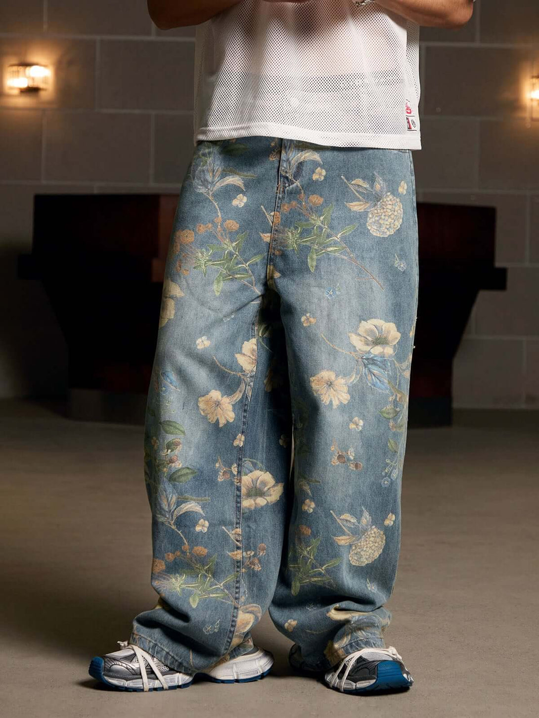 Bring retro vibes to your wardrobe with the Carpenter Pant. Crafted from durable denim, these high-waist, wide-leg pants feature a unique vintage floral print for a standout casual look. The elastic waistband ensures a secure and comfortable fit, while th