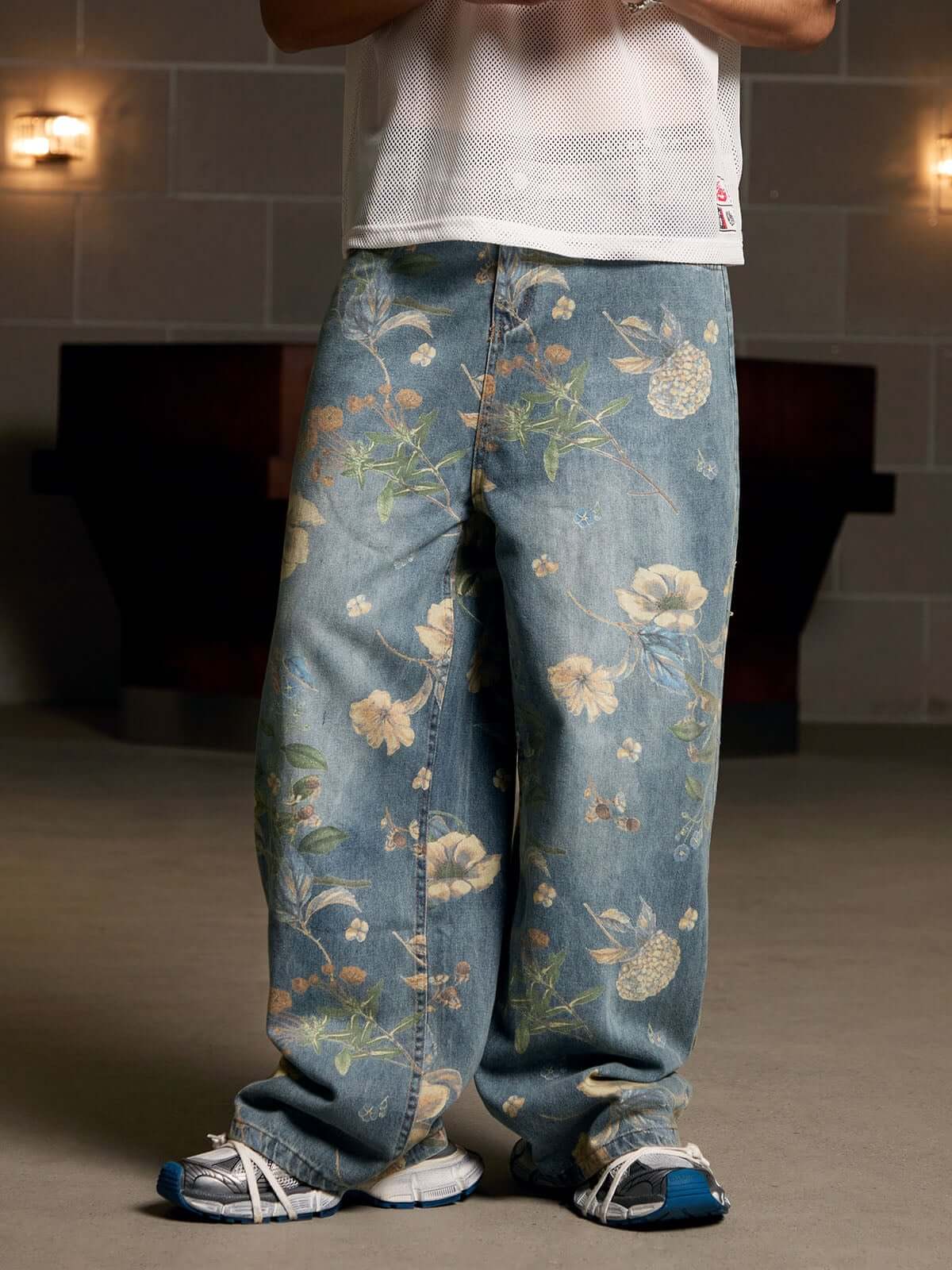 Bring retro vibes to your wardrobe with the Carpenter Pant. Crafted from durable denim, these high-waist, wide-leg pants feature a unique vintage floral print for a standout casual look. The elastic waistband ensures a secure and comfortable fit, while th