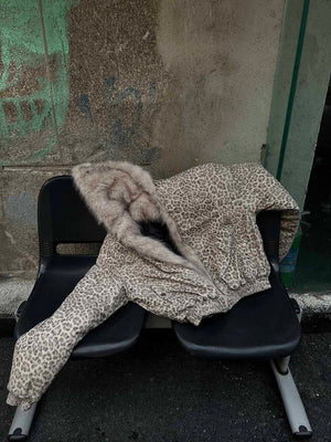 Wrap yourself in bold comfort with the Cheetah Print Mink Fur Hooded Jacket. Made from ultra-soft faux fur with cozy sherpa lining, this winter-ready jacket combines warmth with standout style. It features a detachable hood for versatile wear, ribbed cuff