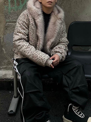 Wrap yourself in bold comfort with the Cheetah Print Mink Fur Hooded Jacket. Made from ultra-soft faux fur with cozy sherpa lining, this winter-ready jacket combines warmth with standout style. It features a detachable hood for versatile wear, ribbed cuff