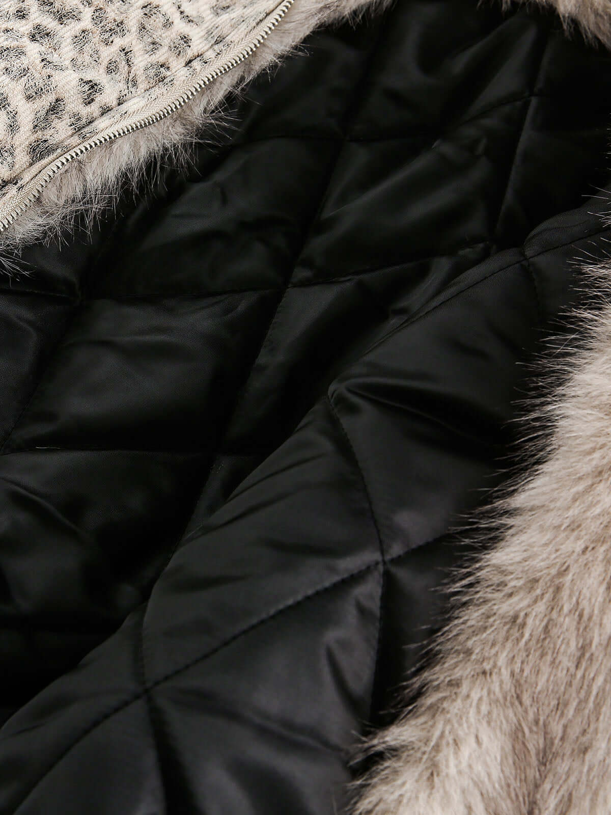 Wrap yourself in bold comfort with the Cheetah Print Mink Fur Hooded Jacket. Made from ultra-soft faux fur with cozy sherpa lining, this winter-ready jacket combines warmth with standout style. It features a detachable hood for versatile wear, ribbed cuff