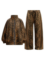 Make a fearless style statement with the Cheetah Print Suede Tracksuit. Crafted from soft and cozy faux fur, this bold matching set includes a zip-up jacket and matching pants, both featuring a standout leopard print design. Designed with ribbed cuffs and