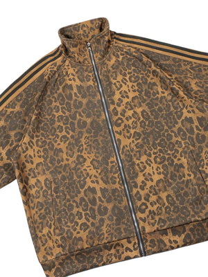 Make a fearless style statement with the Cheetah Print Suede Tracksuit. Crafted from soft and cozy faux fur, this bold matching set includes a zip-up jacket and matching pants, both featuring a standout leopard print design. Designed with ribbed cuffs and