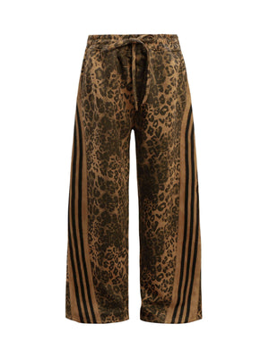 Make a fearless style statement with the Cheetah Print Suede Tracksuit. Crafted from soft and cozy faux fur, this bold matching set includes a zip-up jacket and matching pants, both featuring a standout leopard print design. Designed with ribbed cuffs and