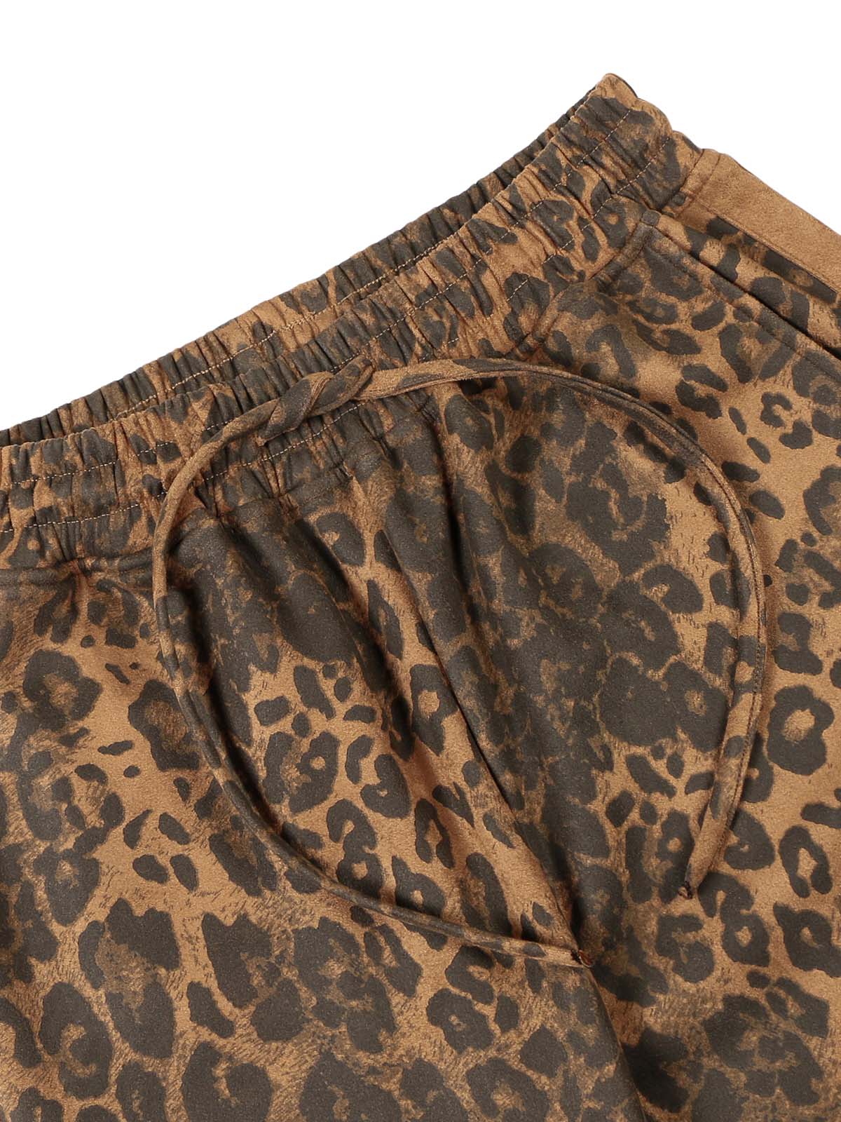 Make a fearless style statement with the Cheetah Print Suede Tracksuit. Crafted from soft and cozy faux fur, this bold matching set includes a zip-up jacket and matching pants, both featuring a standout leopard print design. Designed with ribbed cuffs and