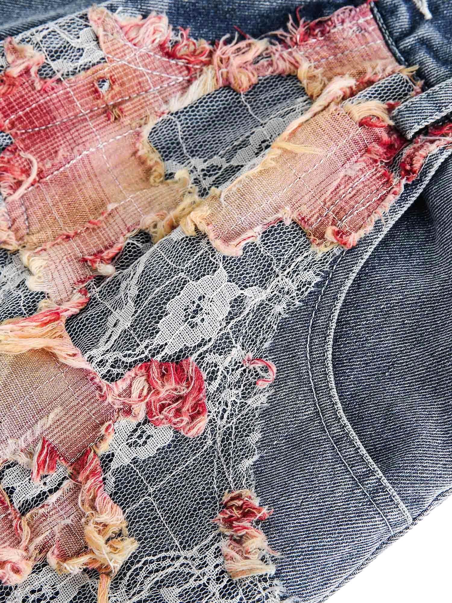 Add a touch of boho charm to your summer look with the Craftsmanship Ripped Floral Denim Shorts. Made from durable denim, these high-waisted shorts feature beautiful floral embroidery and a frayed hem for the perfect blend of femininity and edge. Designed