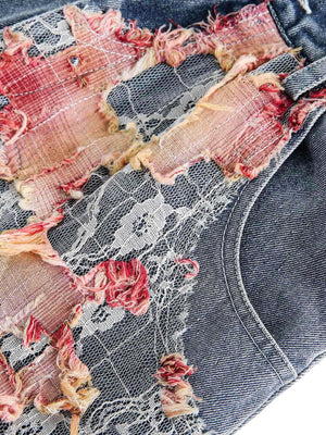 Add a touch of boho charm to your summer look with the Craftsmanship Ripped Floral Denim Shorts. Made from durable denim, these high-waisted shorts feature beautiful floral embroidery and a frayed hem for the perfect blend of femininity and edge. Designed