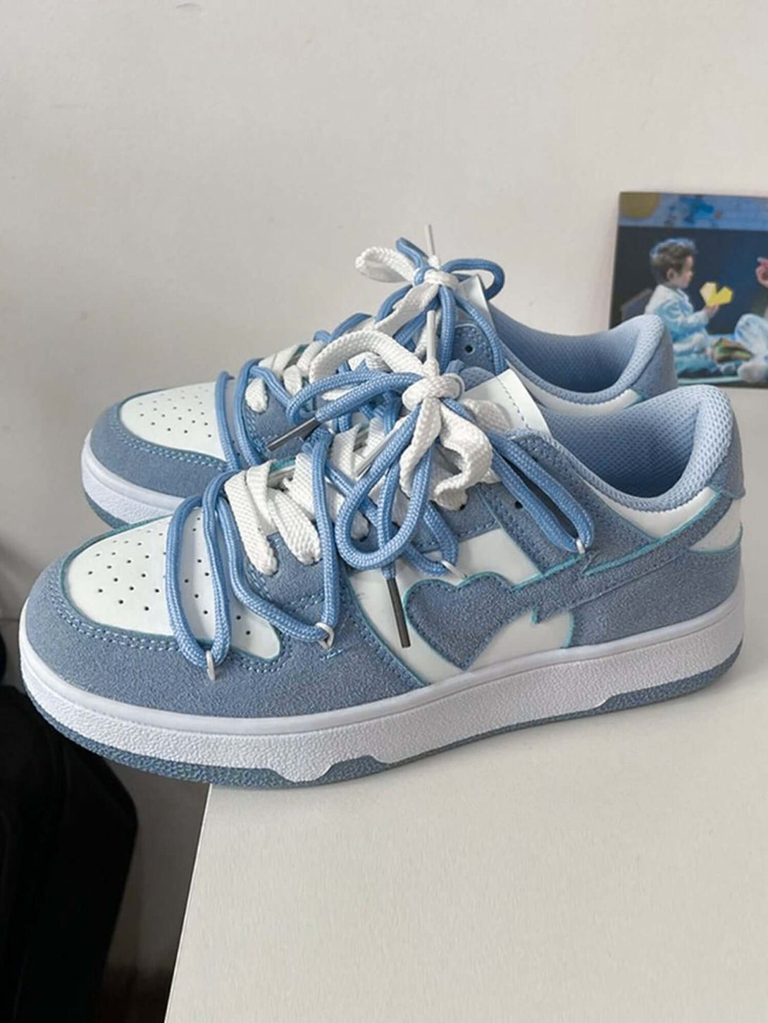 Step into effortless streetwear with the Haze Blue Love Breathable Board Shoes — the perfect balance of comfort, durability, and fresh style. Crafted from lightweight canvas with a sturdy rubber sole, these sneakers feature a classic lace-up closure, perf