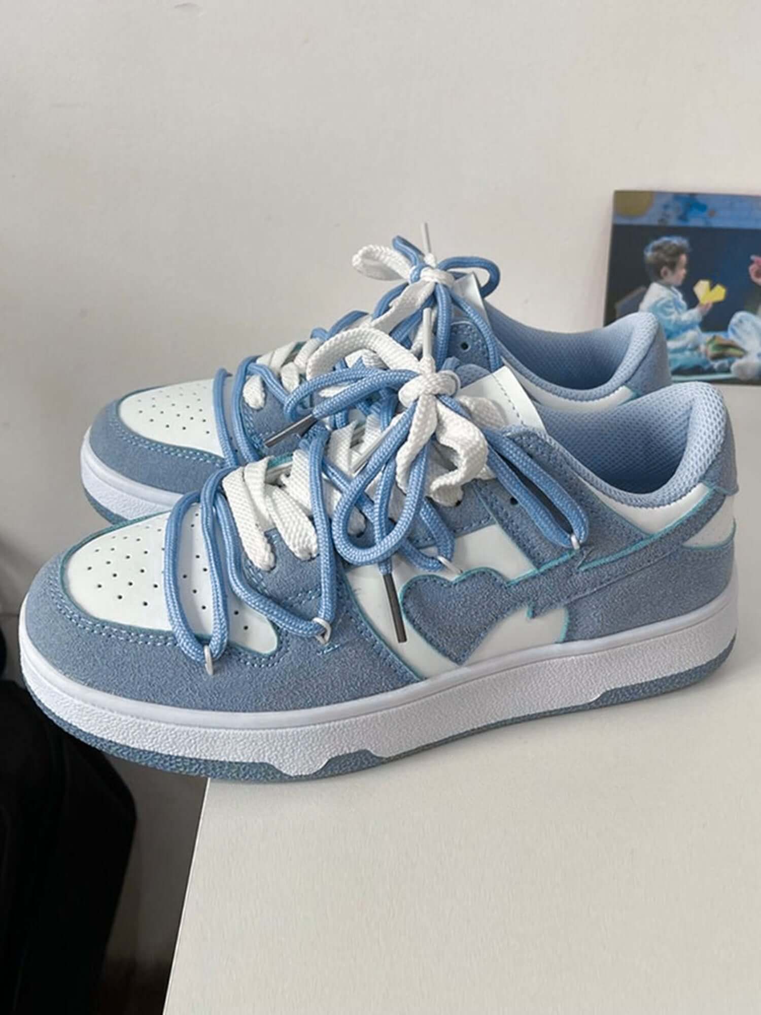 Step into effortless streetwear with the Haze Blue Love Breathable Board Shoes — the perfect balance of comfort, durability, and fresh style. Crafted from lightweight canvas with a sturdy rubber sole, these sneakers feature a classic lace-up closure, perf