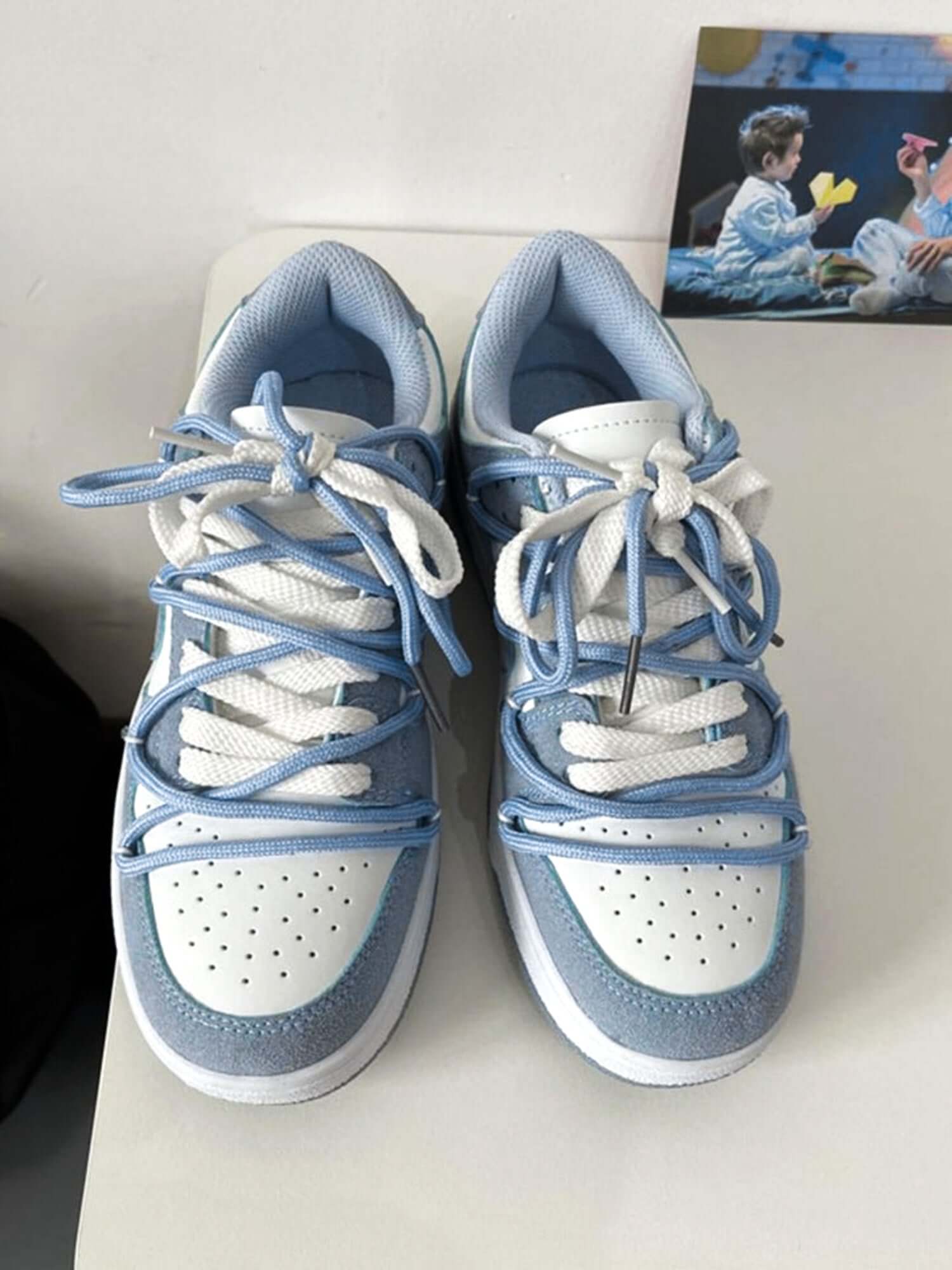 Step into effortless streetwear with the Haze Blue Love Breathable Board Shoes — the perfect balance of comfort, durability, and fresh style. Crafted from lightweight canvas with a sturdy rubber sole, these sneakers feature a classic lace-up closure, perf