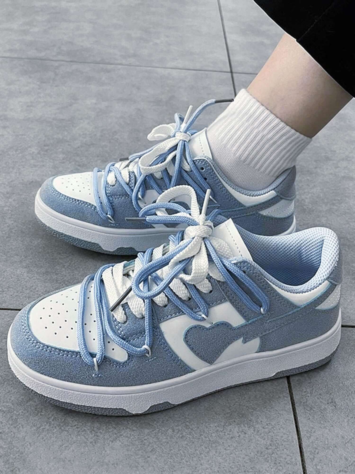 Step into effortless streetwear with the Haze Blue Love Breathable Board Shoes — the perfect balance of comfort, durability, and fresh style. Crafted from lightweight canvas with a sturdy rubber sole, these sneakers feature a classic lace-up closure, perf