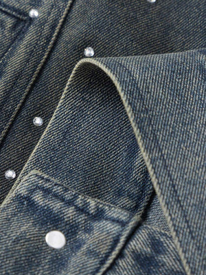 Bring vintage attitude to your wardrobe with the Hip-hop Beaded Washed Denim Jacket — a standout fusion of rugged style and everyday comfort. Crafted from durable denim, this jacket features a unique distressed wash, button closure, chest pockets, and a c