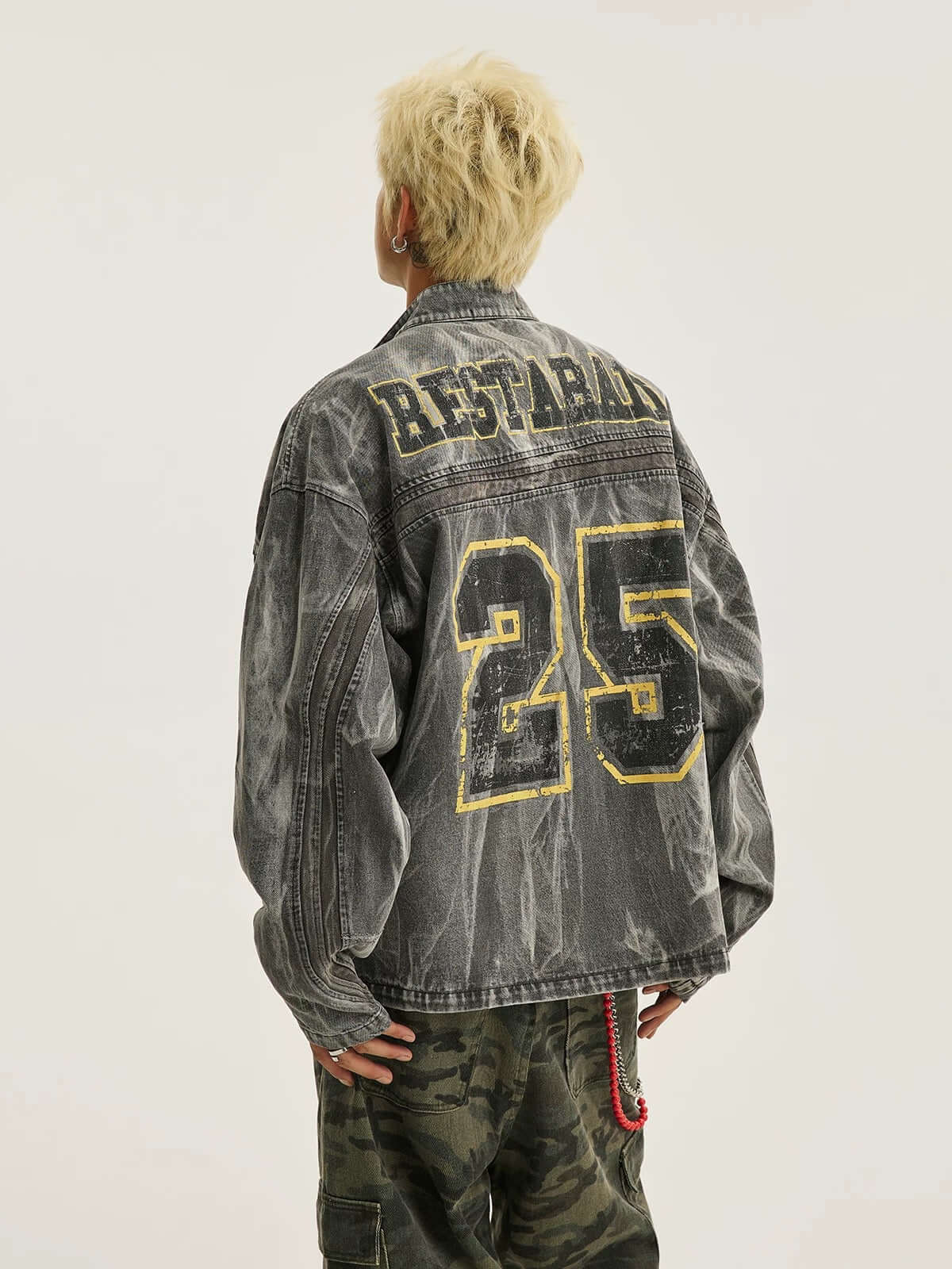 Bring bold urban vibes to your wardrobe with the Hip-hop Distressed Washed Printed Denim Jacket — a perfect fusion of rugged style and everyday comfort. Made from durable denim, this jacket features a trendy camouflage print, distressed detailing, ribbed