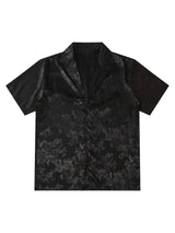 Step into sleek sophistication with the Leaves Pattern Black Vintage Shirt — a versatile piece that blends vintage charm with modern elegance. Made from smooth satin fabric, this short-sleeved shirt features a notched lapel collar, button-up front, and a