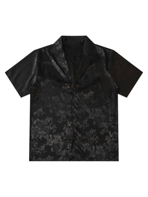 Step into sleek sophistication with the Leaves Pattern Black Vintage Shirt — a versatile piece that blends vintage charm with modern elegance. Made from smooth satin fabric, this short-sleeved shirt features a notched lapel collar, button-up front, and a