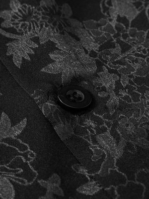 Step into sleek sophistication with the Leaves Pattern Black Vintage Shirt — a versatile piece that blends vintage charm with modern elegance. Made from smooth satin fabric, this short-sleeved shirt features a notched lapel collar, button-up front, and a