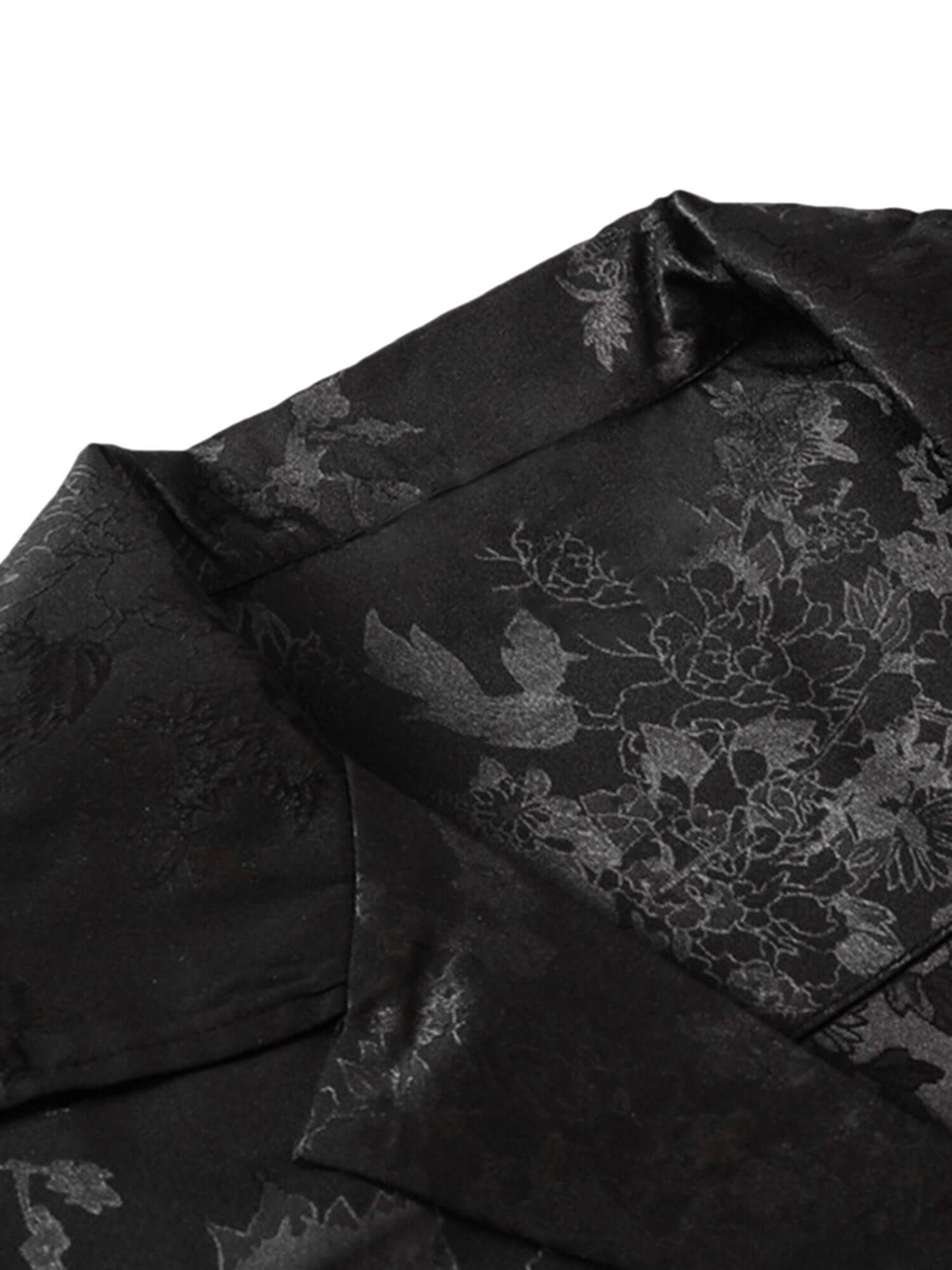 Step into sleek sophistication with the Leaves Pattern Black Vintage Shirt — a versatile piece that blends vintage charm with modern elegance. Made from smooth satin fabric, this short-sleeved shirt features a notched lapel collar, button-up front, and a
