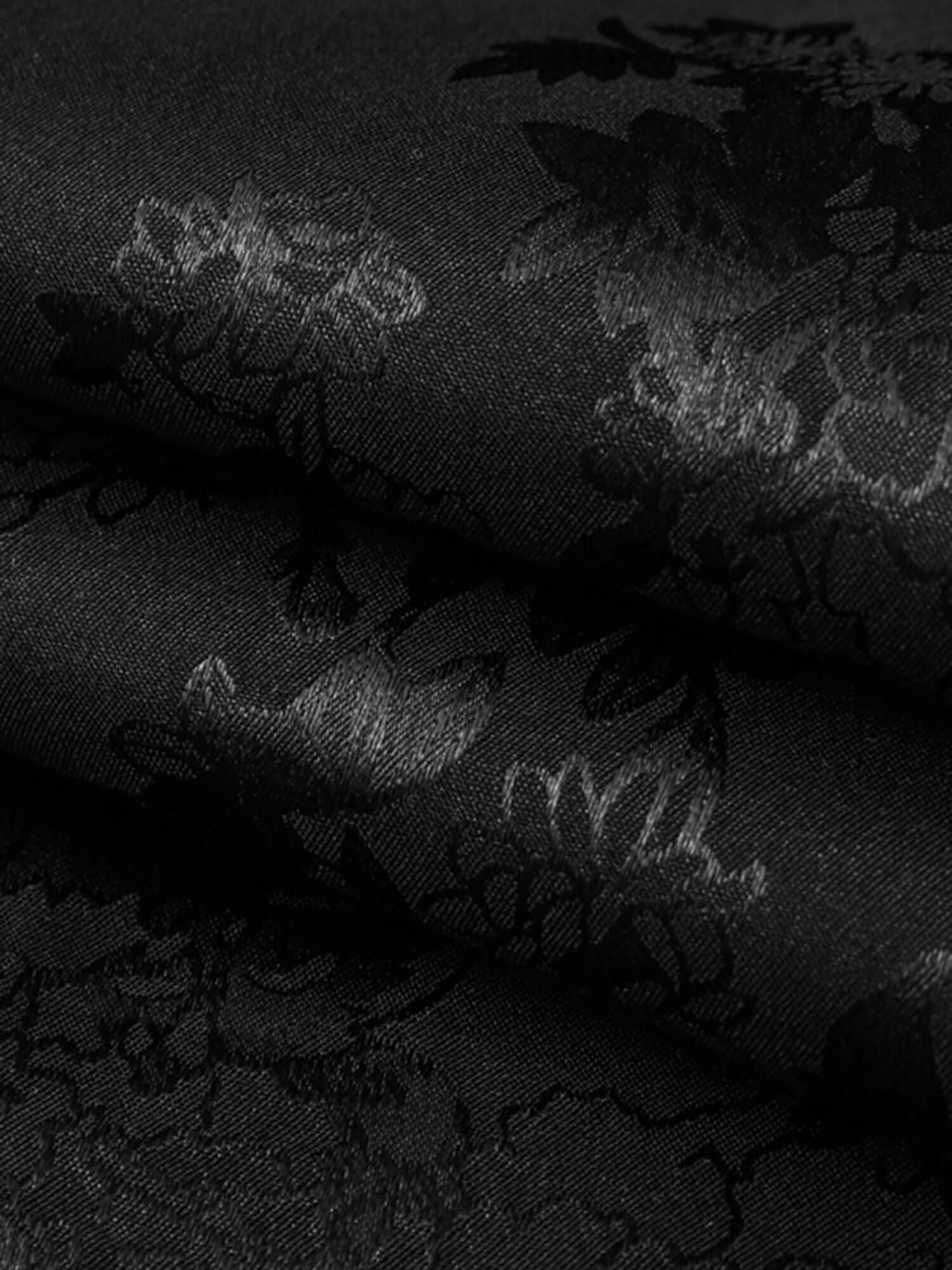 Step into sleek sophistication with the Leaves Pattern Black Vintage Shirt — a versatile piece that blends vintage charm with modern elegance. Made from smooth satin fabric, this short-sleeved shirt features a notched lapel collar, button-up front, and a