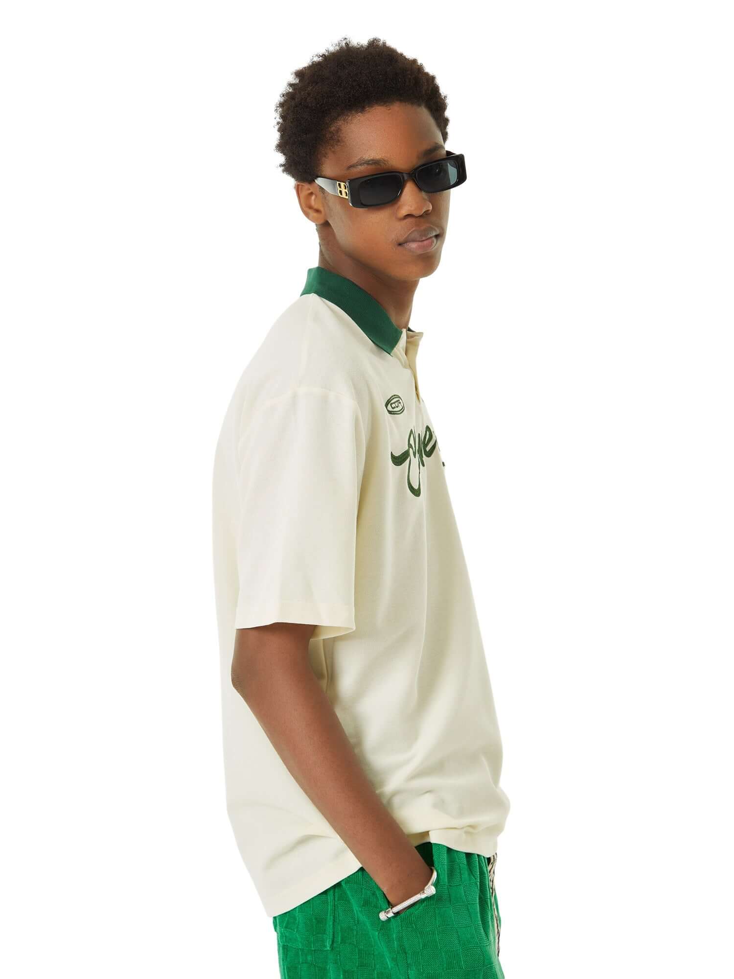 Refresh your casual wardrobe with the Letter Embroidered Polo Shirt. Crafted from a soft and breathable cotton blend, this polo shirt features a stylish embroidered script logo, a contrast collar, and striped sleeve details that add a modern twist to a cl