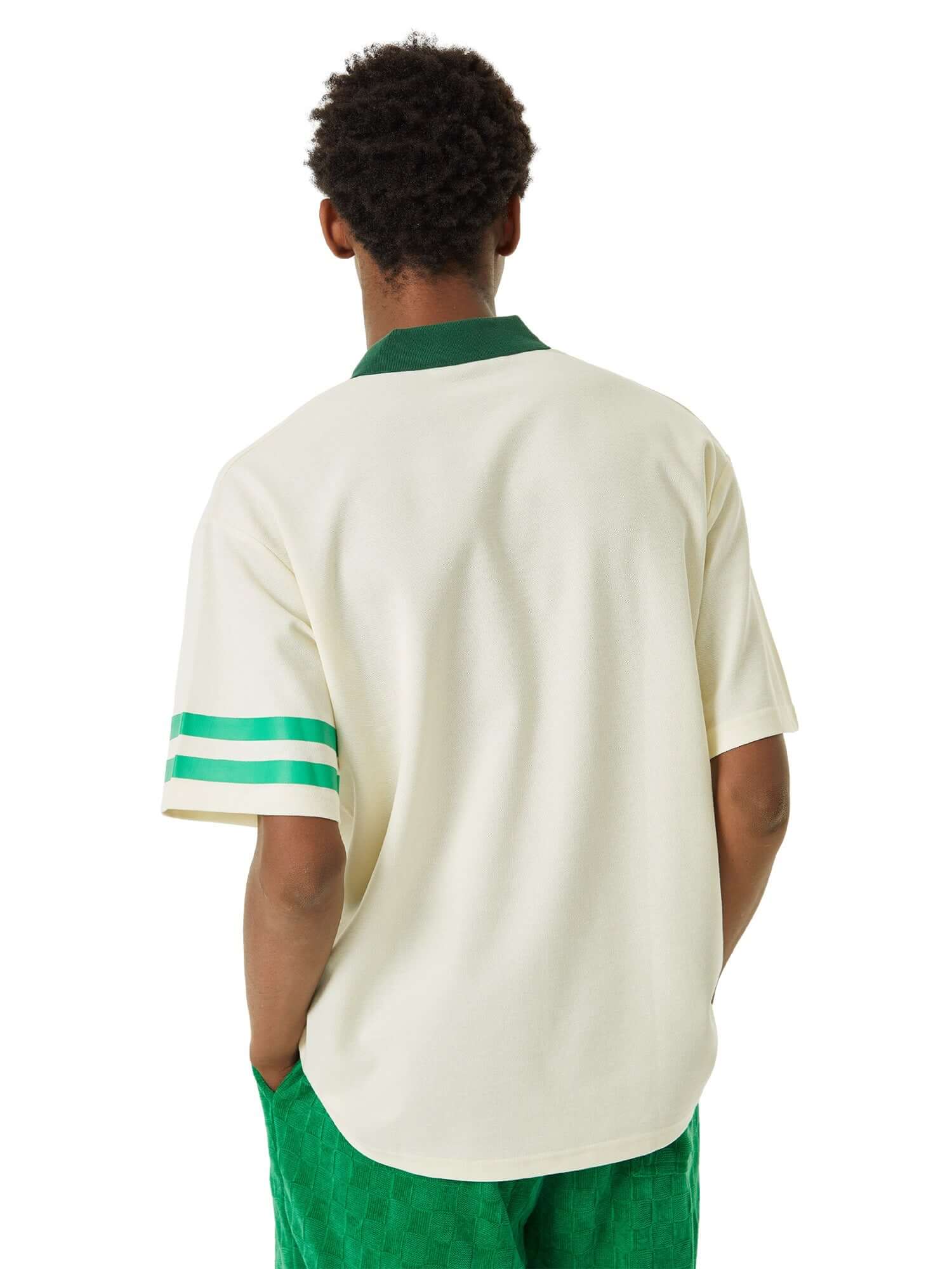 Refresh your casual wardrobe with the Letter Embroidered Polo Shirt. Crafted from a soft and breathable cotton blend, this polo shirt features a stylish embroidered script logo, a contrast collar, and striped sleeve details that add a modern twist to a cl