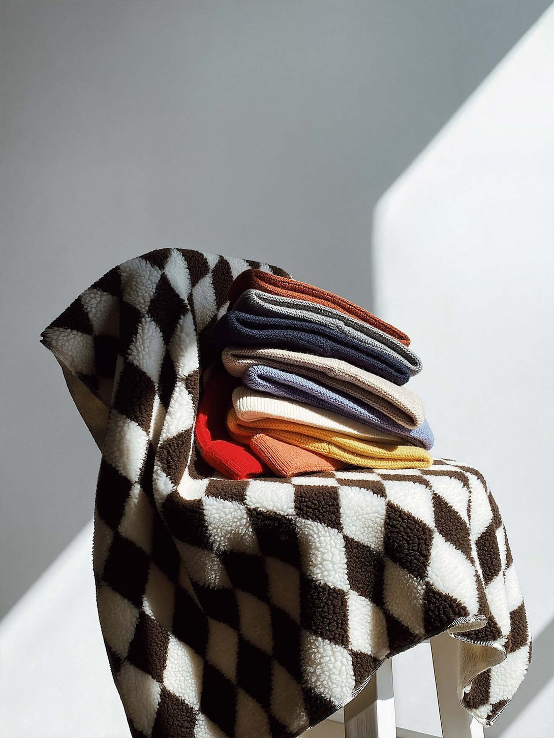 Stay cozy and effortlessly stylish with the Mini Fisherman Beanie — a must-have accessory for cooler days. Made from soft acrylic, this ribbed knit hat features a wide brim and stretchy fit that sits snugly and comfortably on the head. Available in a rang