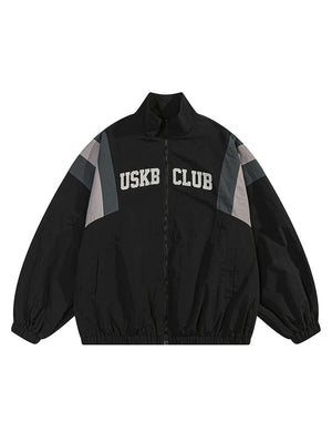 Step out in bold confidence with the Patchwork Contrasting Windbreaker Jacket — a lightweight statement piece inspired by retro athletic wear. Made from durable polyester, this jacket features a dynamic color-block pattern with contrast panels, a branded