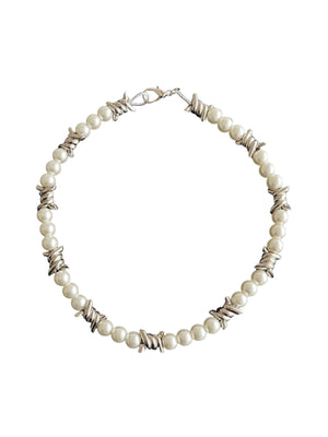 Blend elegance with edge in the Punk Pearl Necklace — a unique accessory that redefines classic charm with a modern twist. Featuring delicate pearls, silver-plated chain links, and shimmering star charms, this piece offers a bold yet feminine vibe. With a