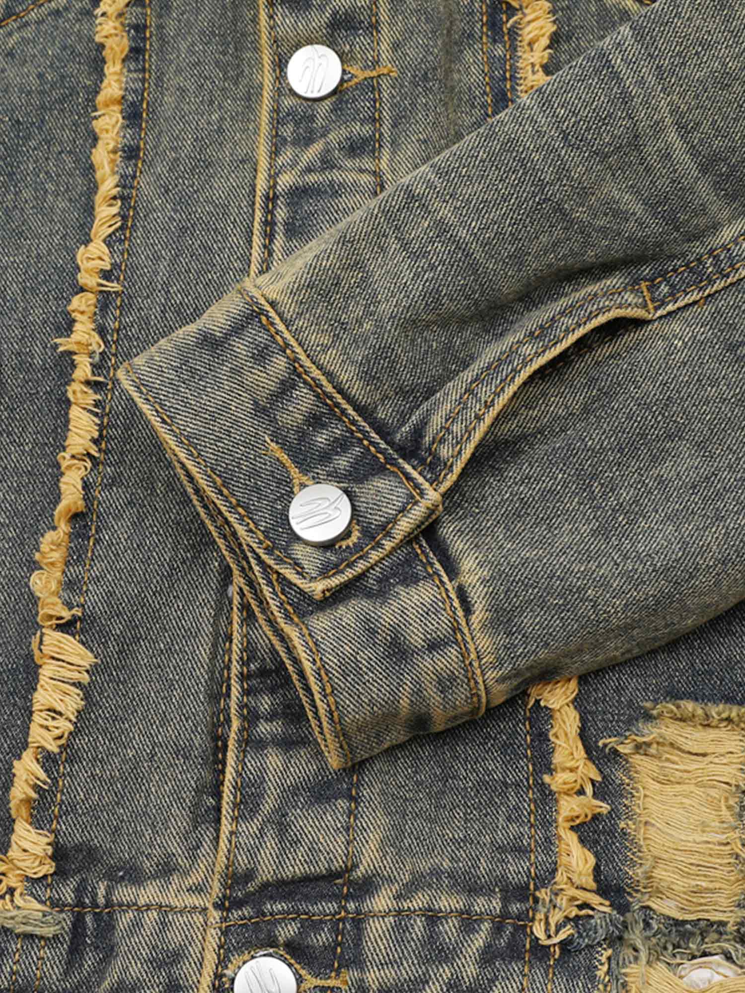 Turn heads with the Raw Edge Distressed Denim Jacket — a bold streetwear essential combining rugged denim with statement gold chain detailing. This long-sleeve jacket features raw hems, distressed accents, and front chest pockets with button closure for a