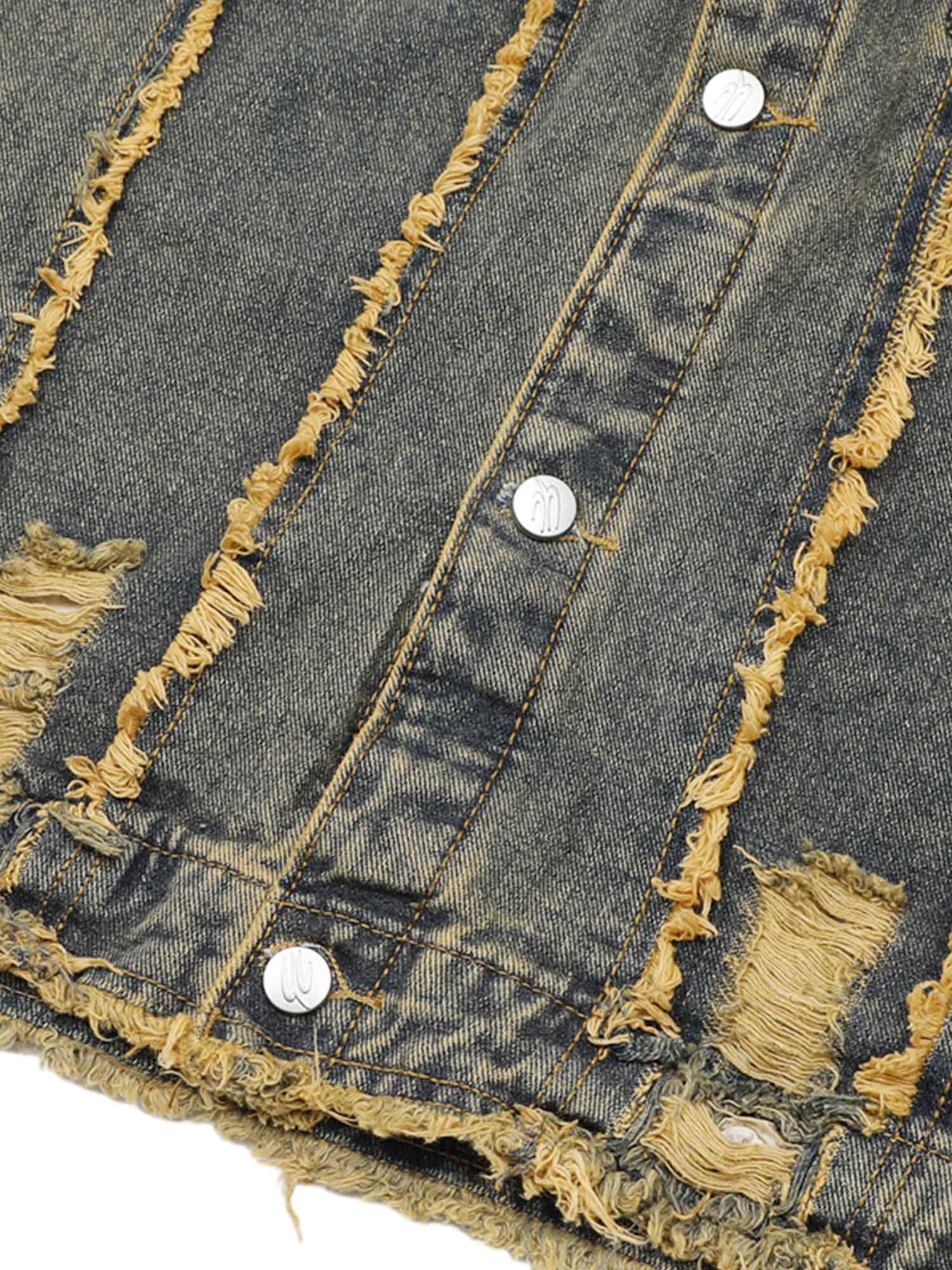 Turn heads with the Raw Edge Distressed Denim Jacket — a bold streetwear essential combining rugged denim with statement gold chain detailing. This long-sleeve jacket features raw hems, distressed accents, and front chest pockets with button closure for a