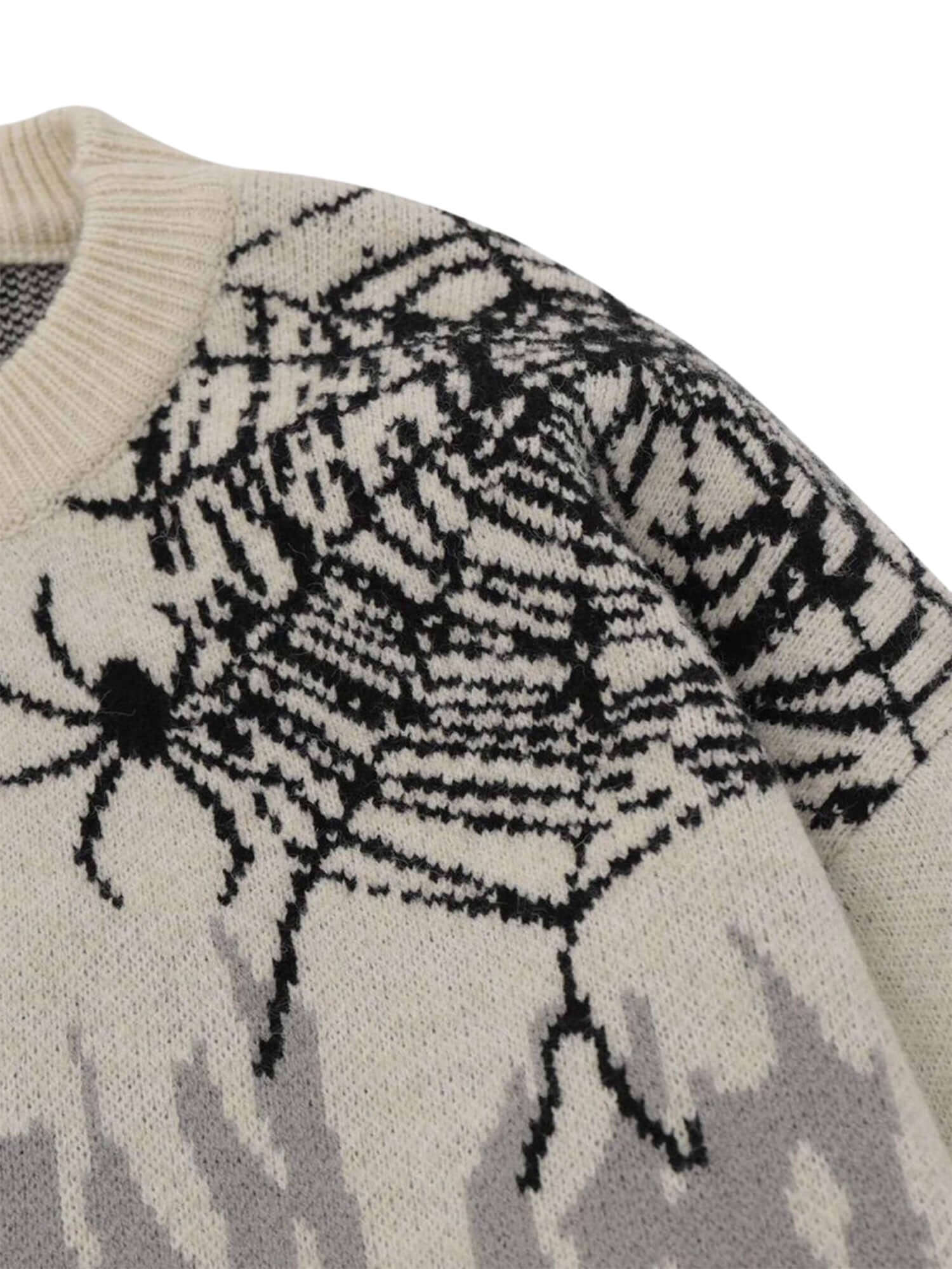 Embrace edgy street style with the Round Neck Spider Destroy Design Sweater. Crafted from a soft and breathable cotton blend, this standout sweater features bold spider web and skull graphics, a distressed hem, and a comfortable crew neck with long sleeve