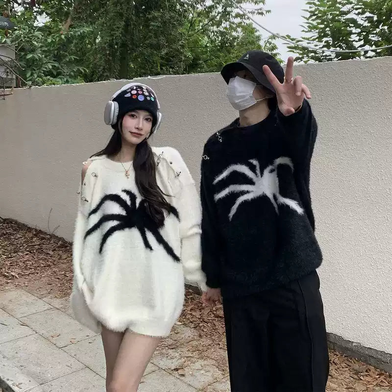 Add a bold edge to your fall and winter wardrobe with the Spider Mohair Sweater. Crafted from soft, cozy knit fabric, this standout piece features a striking spider graphic design, making it perfect for casual outings, Halloween events, or adding a daring