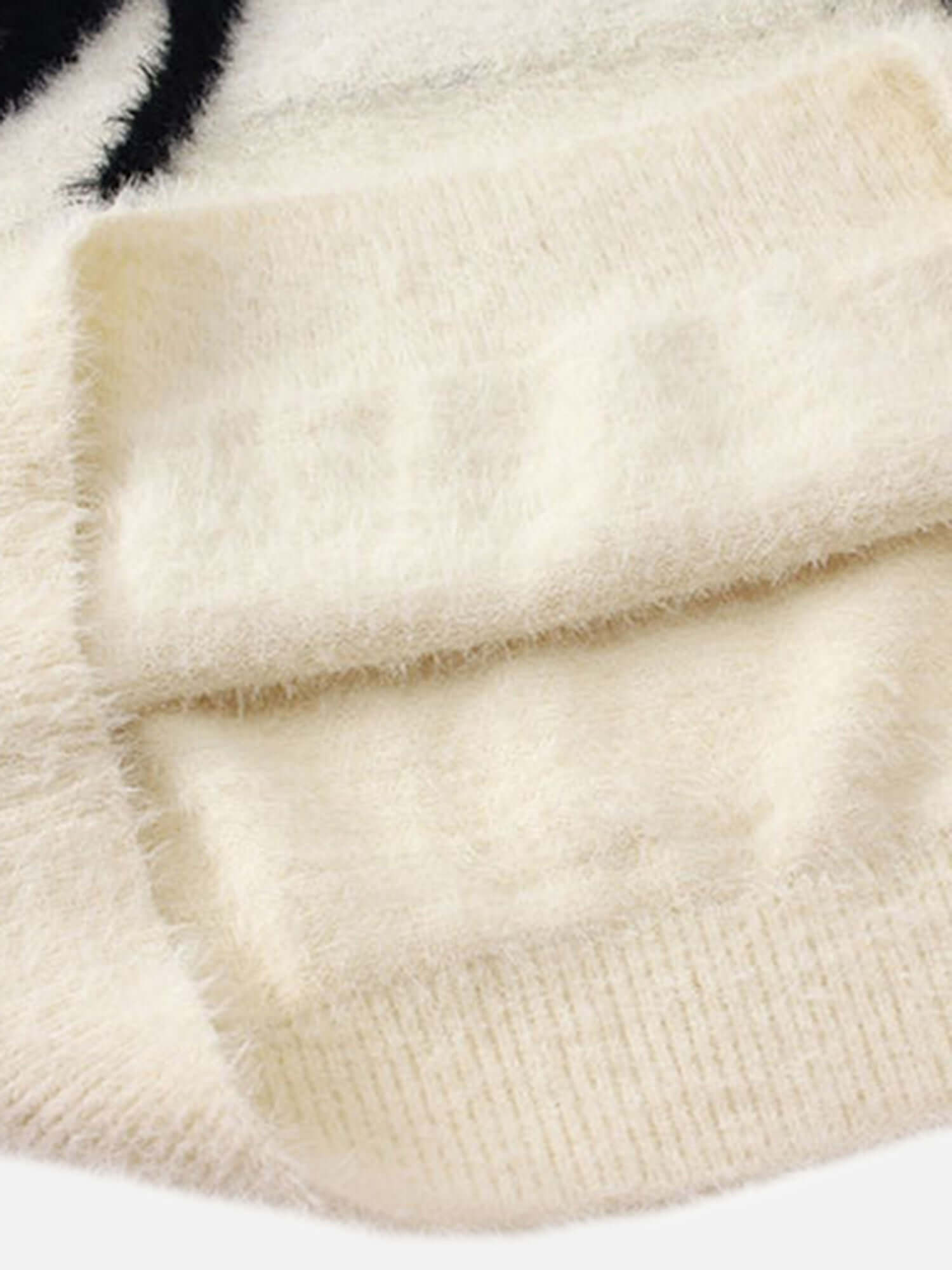 Add a bold edge to your fall and winter wardrobe with the Spider Mohair Sweater. Crafted from soft, cozy knit fabric, this standout piece features a striking spider graphic design, making it perfect for casual outings, Halloween events, or adding a daring