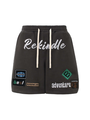 Add personality to your casual look with the Street Graphic Drawstring Shorts — a bold mix of comfort and creativity. Made from a soft cotton blend, these relaxed-fit shorts feature a colorful patchwork design with durable embroidered details, including a
