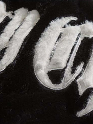 Make a bold impression with the Street Letter Embroidered Fleece Jacket. Crafted from ultra-soft faux fur, this oversized winter essential combines warmth, comfort, and eye-catching streetwear design. The jacket features bold embroidered text across the b