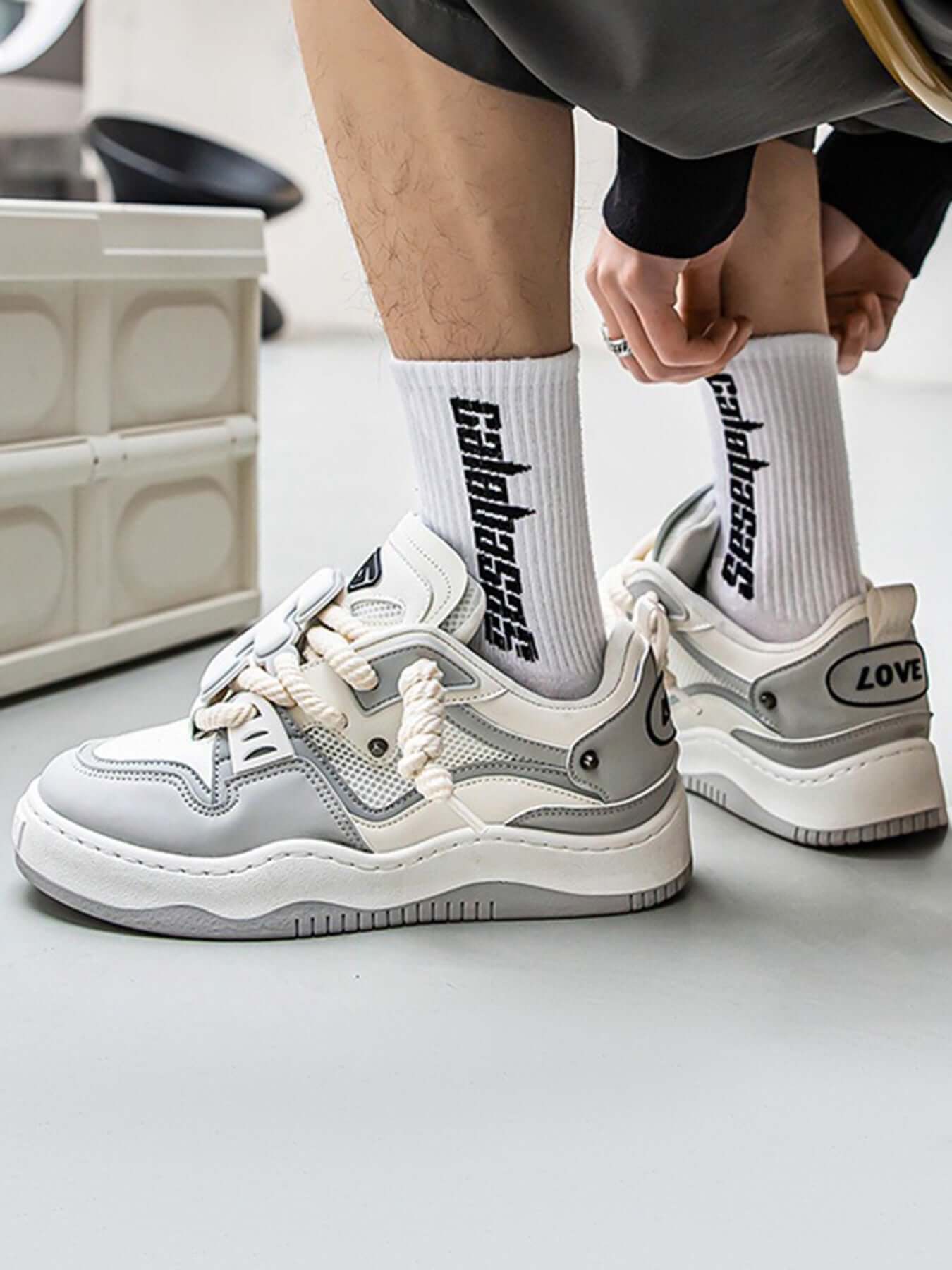 Stay active and stylish with The Niche Thick Bottom Hundred With Board Shoes — a perfect fusion of functionality and modern design. Crafted from breathable mesh and durable synthetic leather, these sneakers feature easy-to-adjust velcro straps for a secur