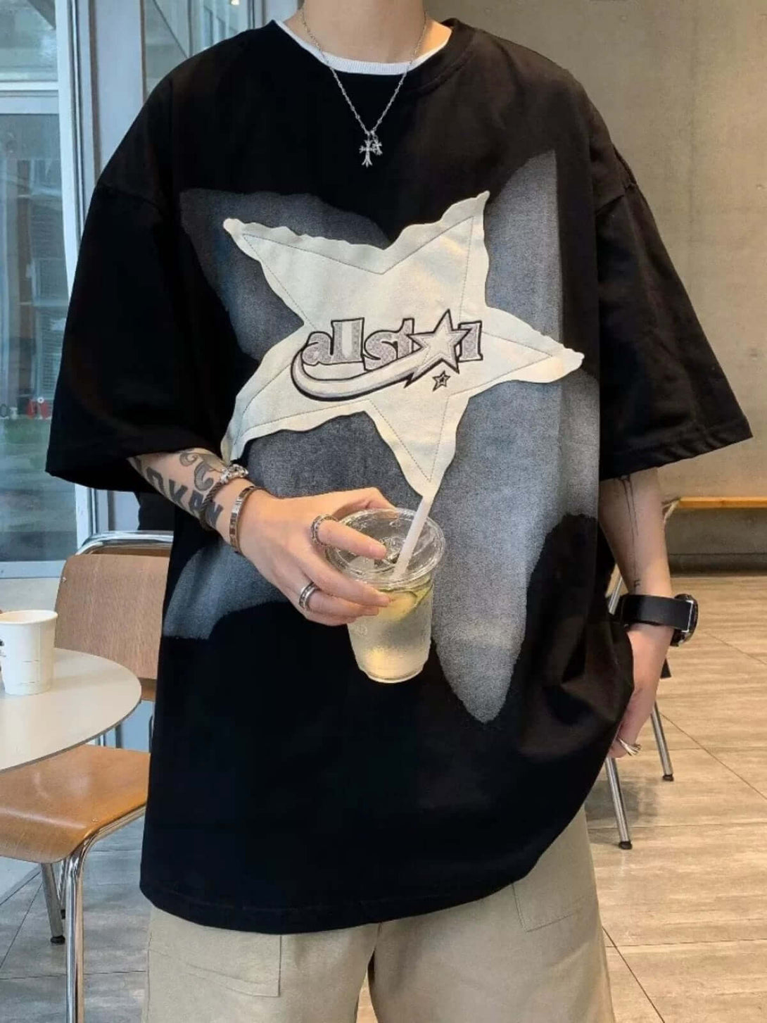 Add a touch of vintage flair to your everyday outfit with the Vintage Star Loose T Shirt. Crafted from a soft and breathable cotton blend, this relaxed-fit tee features a bold star graphic and slogan detail that bring effortless streetwear attitude. With