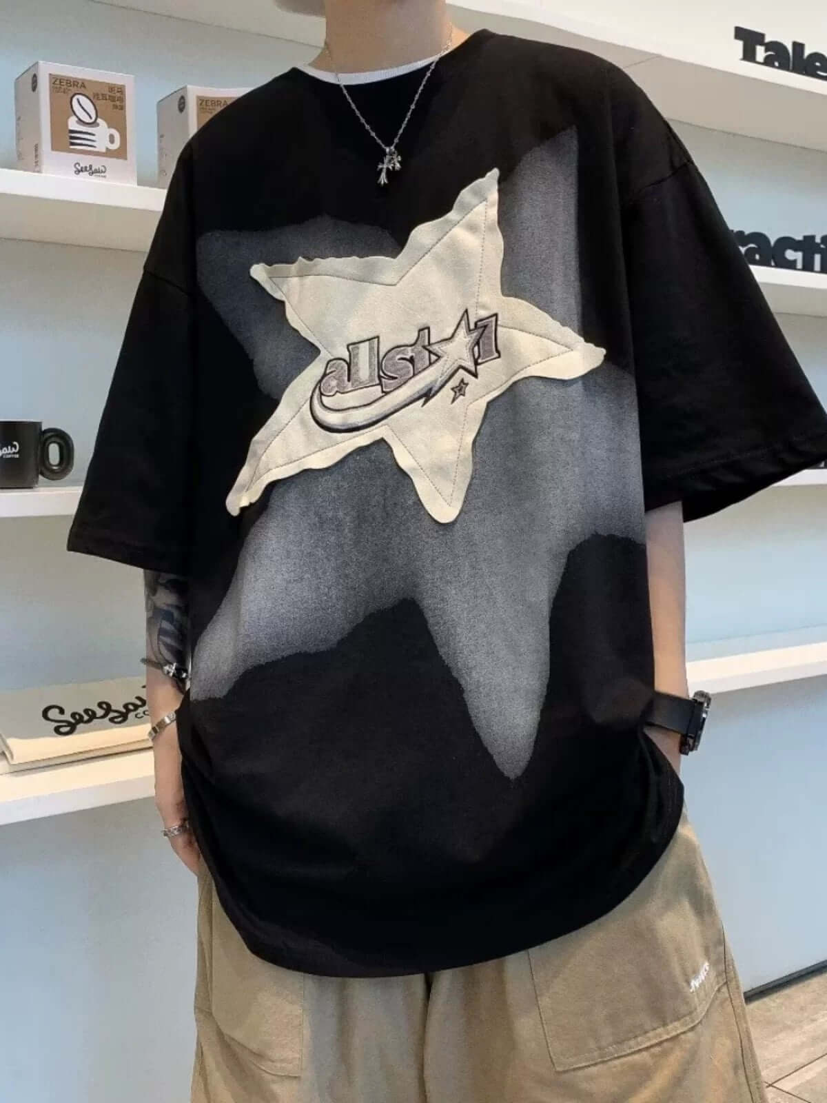 Add a touch of vintage flair to your everyday outfit with the Vintage Star Loose T Shirt. Crafted from a soft and breathable cotton blend, this relaxed-fit tee features a bold star graphic and slogan detail that bring effortless streetwear attitude. With