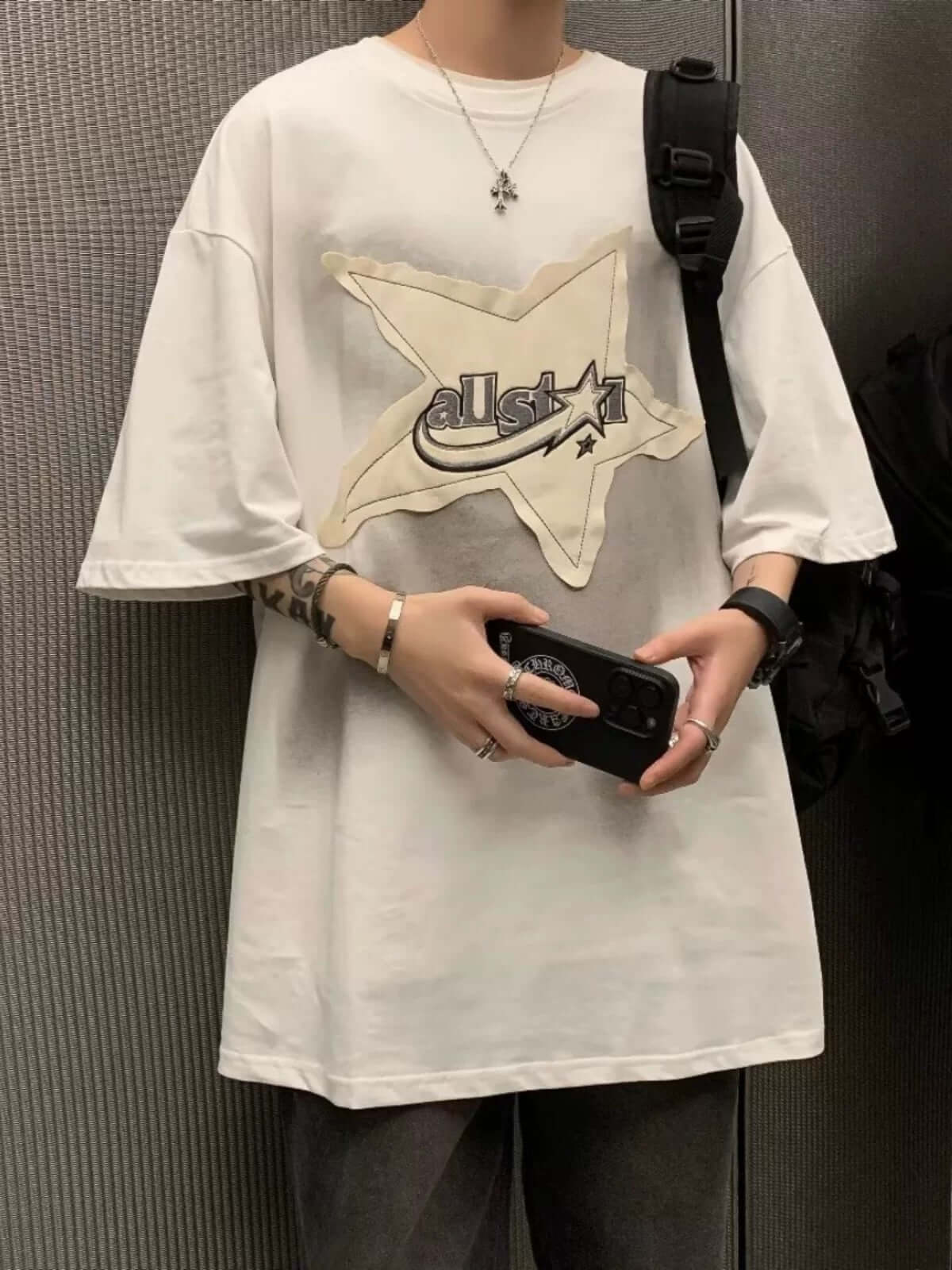 Add a touch of vintage flair to your everyday outfit with the Vintage Star Loose T Shirt. Crafted from a soft and breathable cotton blend, this relaxed-fit tee features a bold star graphic and slogan detail that bring effortless streetwear attitude. With