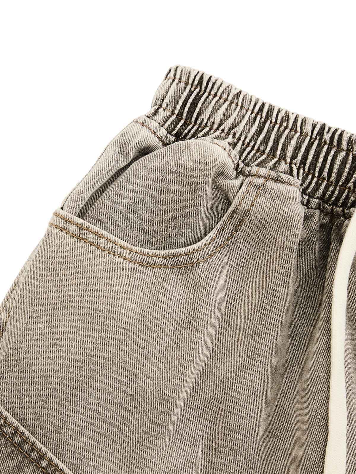 Bring effortless edge to your casual wardrobe with the Vintage Wash Deconstructed Drawstring Denim Shorts. Made from premium denim, these relaxed-fit shorts feature an elastic waistband with an adjustable drawstring for maximum comfort and flexibility. Th