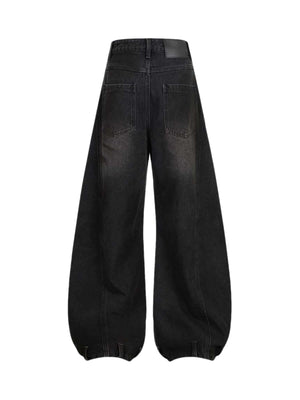 Add effortless edge to your look with the Washed Distressed Jeans. Made from durable denim, these wide-leg jeans feature distressed details for a bold, worn-in street style vibe. The elastic waistband ensures a comfortable, flexible fit — perfect for casu