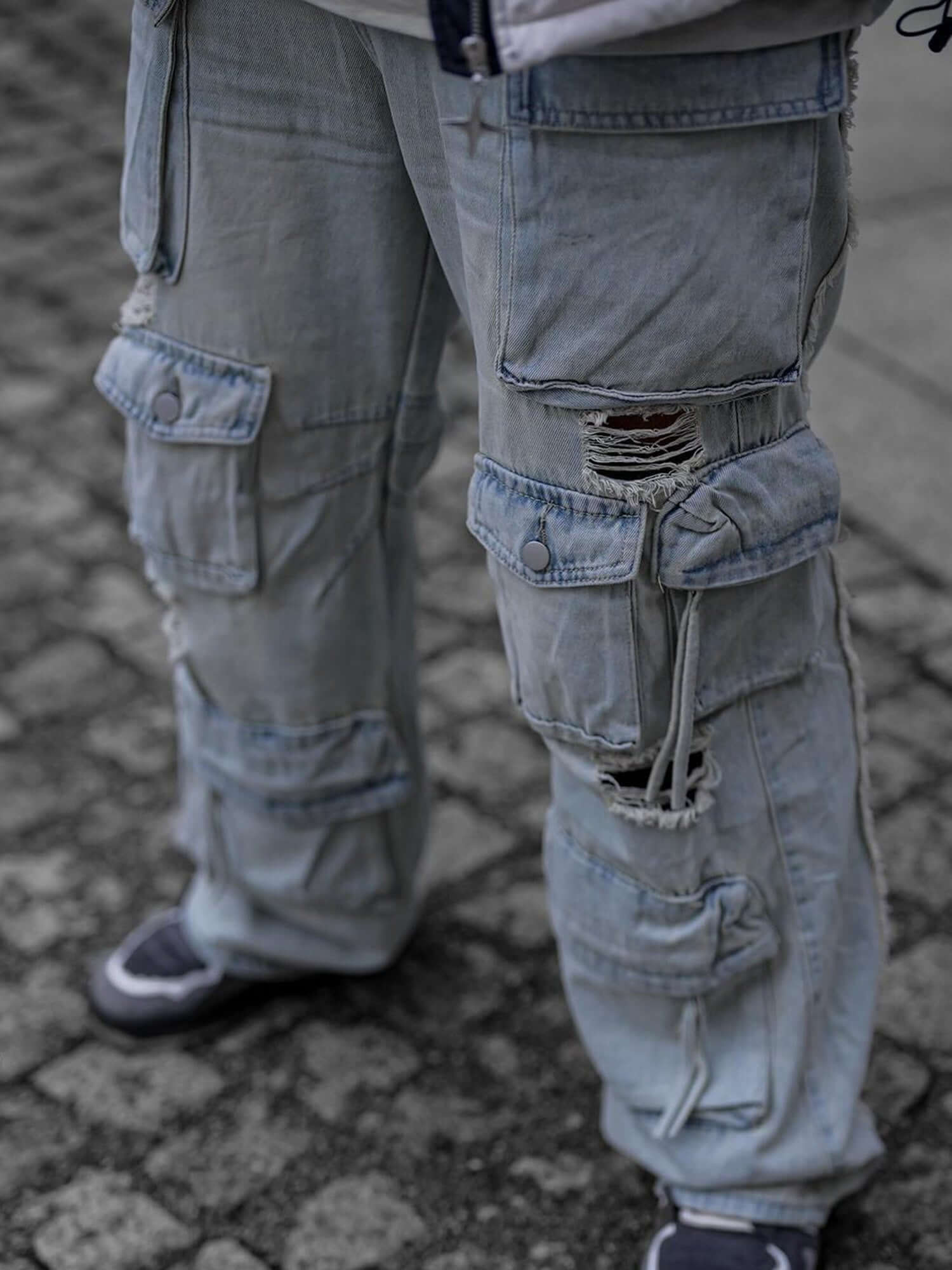 Blend function and fashion with the Washed Multi Pocket Work Cargo Jeans. Made from durable denim, these utility-inspired jeans feature a trendy distressed wash, a loose comfortable fit, and an adjustable waistband for a customizable feel. With multiple s