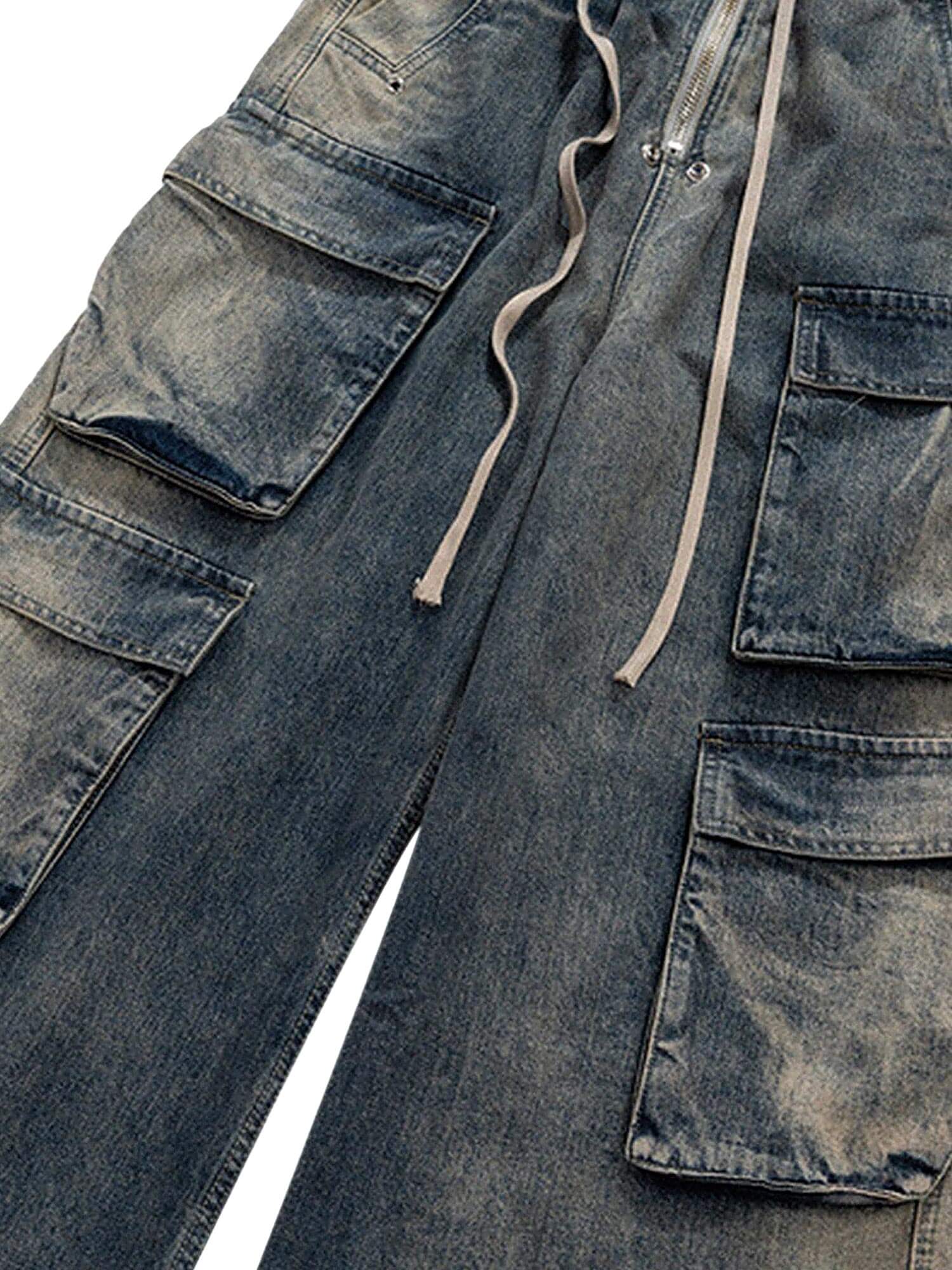 Elevate your casual style with the Wide Leg Multi Pocket Straight Leg Loose Jeans. Crafted from durable denim, these jeans feature a relaxed wide-leg silhouette, multiple side pockets for practicality, and an adjustable drawstring for a customizable fit.